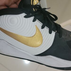 Nike Black and White Shoes with Gold Accent
